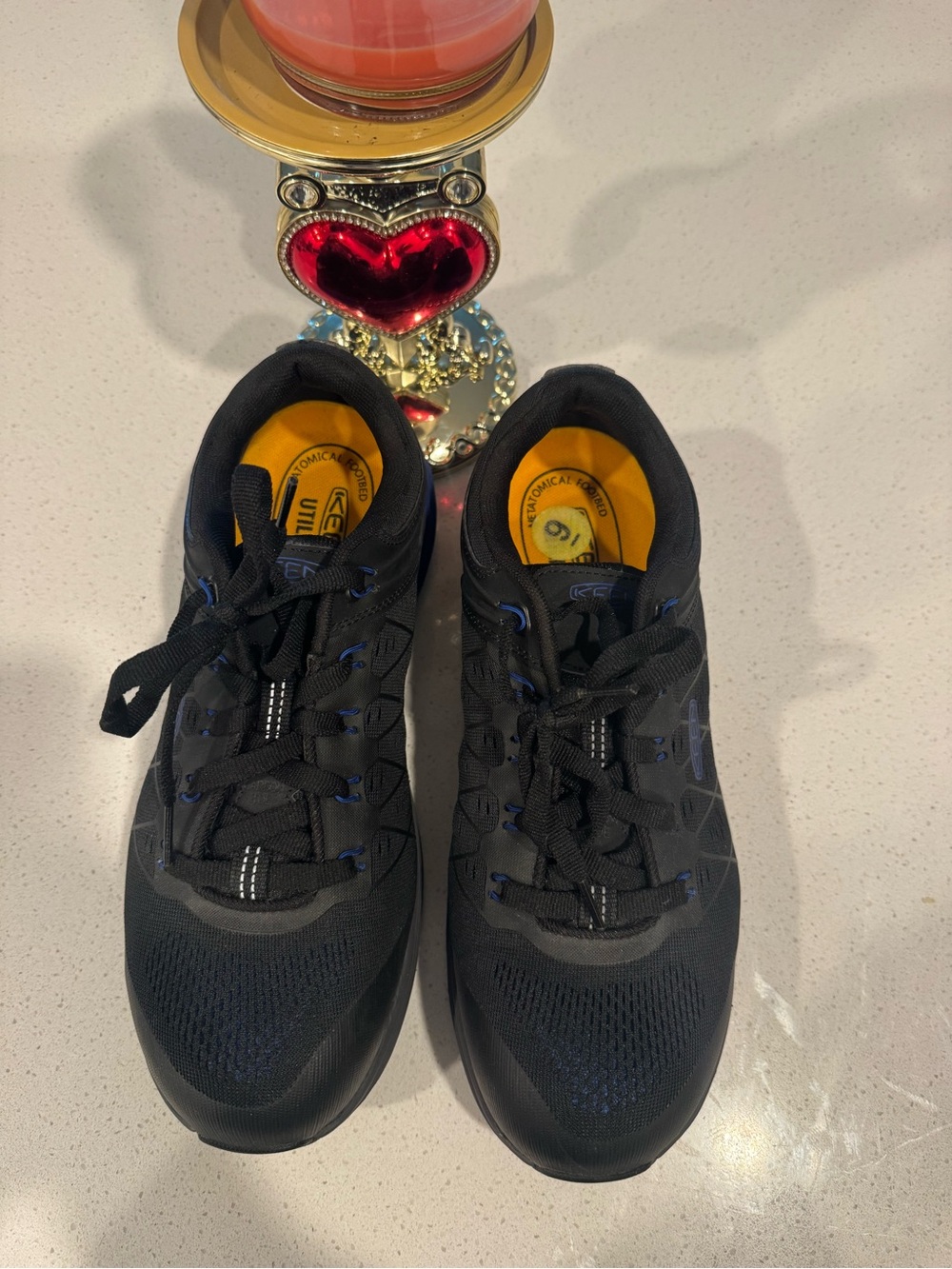 KEEN Men's Black Athletic Shoes with Yellow Insoles and Blue Accents
